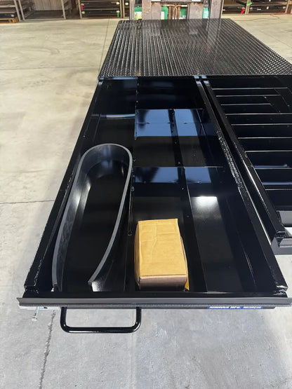 Black truck bed storage system with the left‑hand drawer extended.